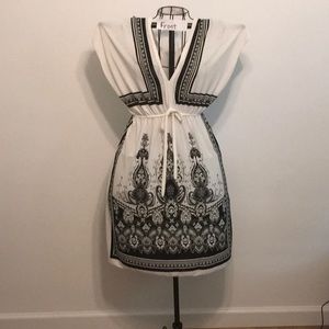 Creamy white and black light weight dress or bathing suit cover up.